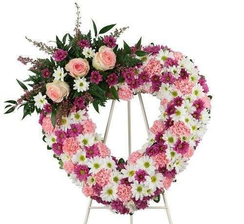 Corazón con moño rosado