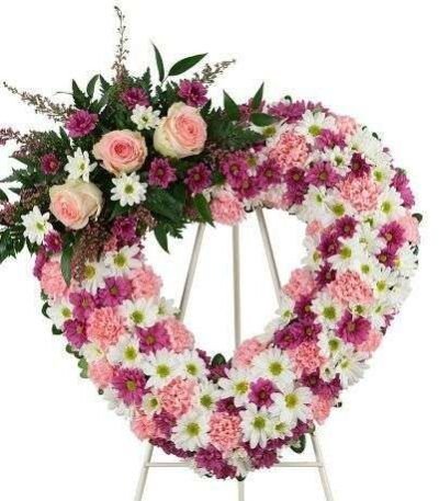 Corazón con moño rosado